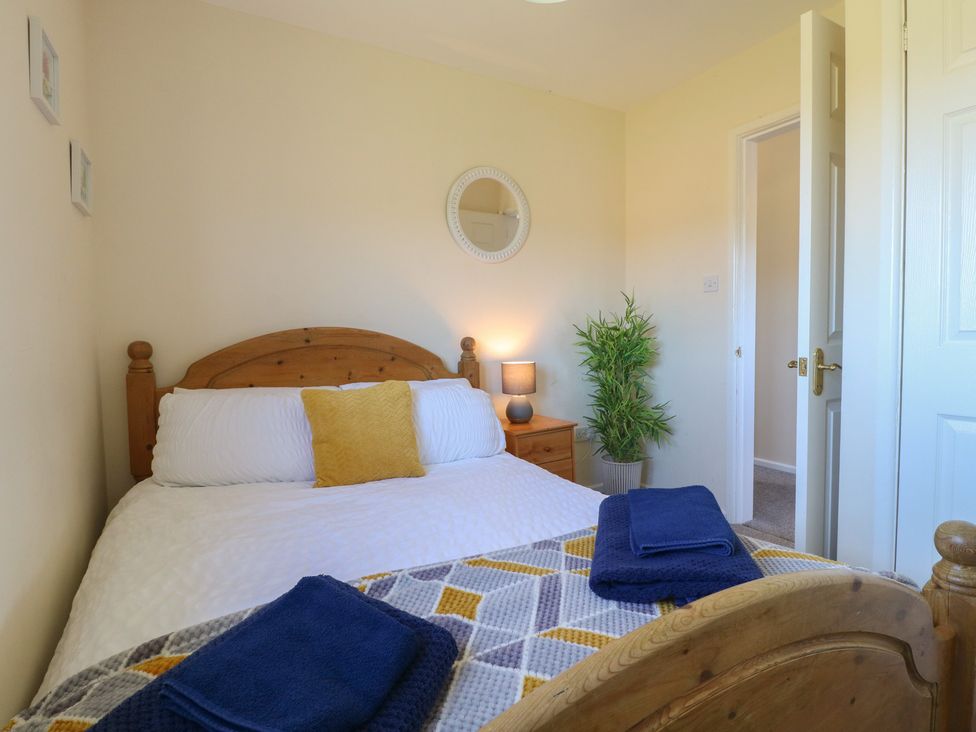 A bedroom with a bed and lamp at Tixall Manor Farm Tixall near Great Haywood