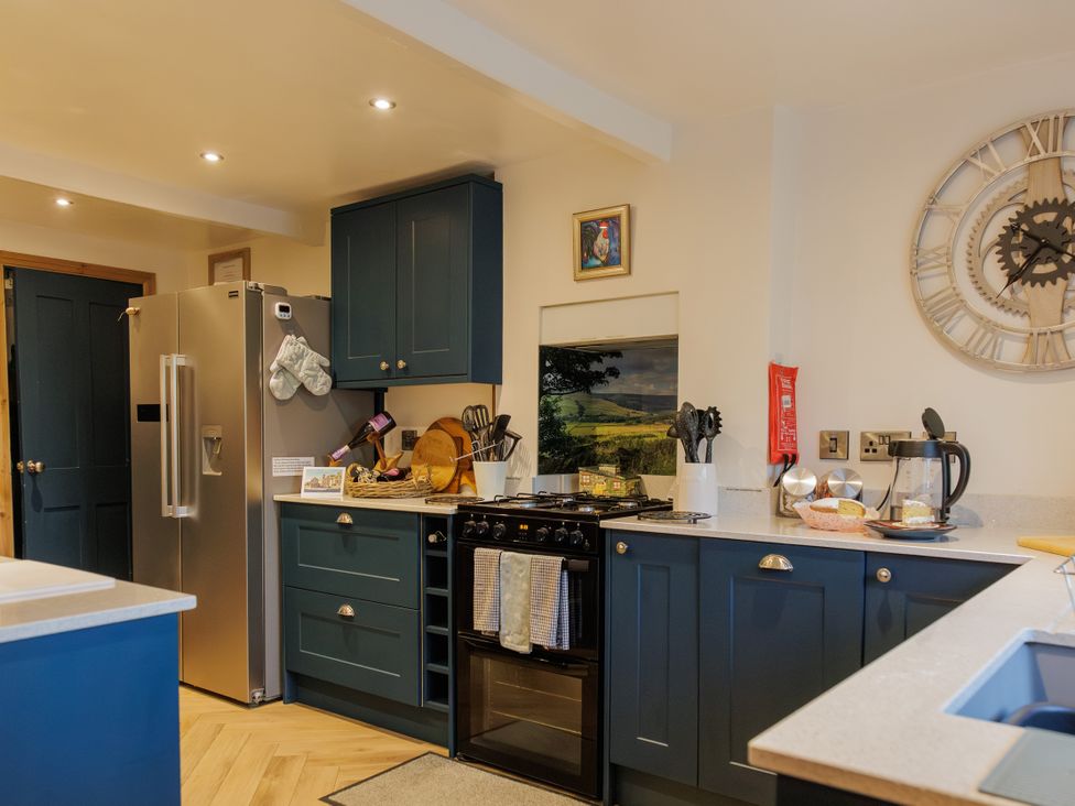 A kitchen with appliances and utensils at Wells Cottage in Holmfirth