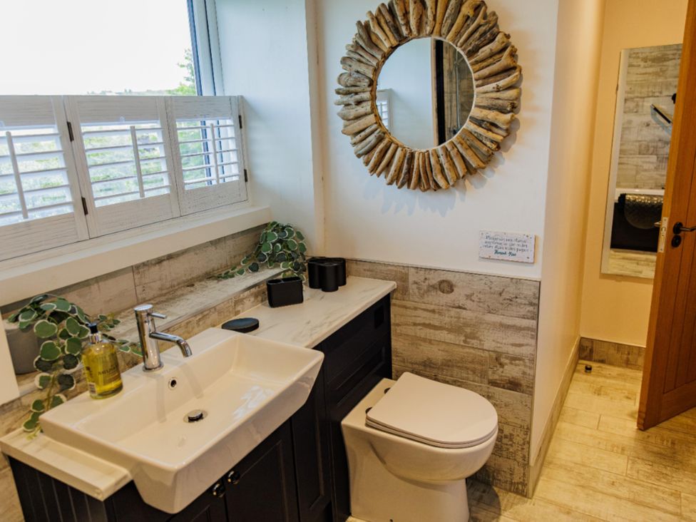 A bathroom with a sink and toilet at Wells Cottage in Holmfirth