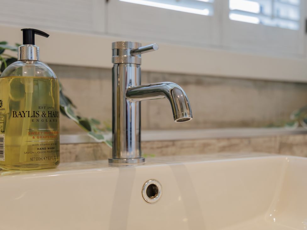 A sink with a faucet and hand wash at Wells Cottage in Holmfirth