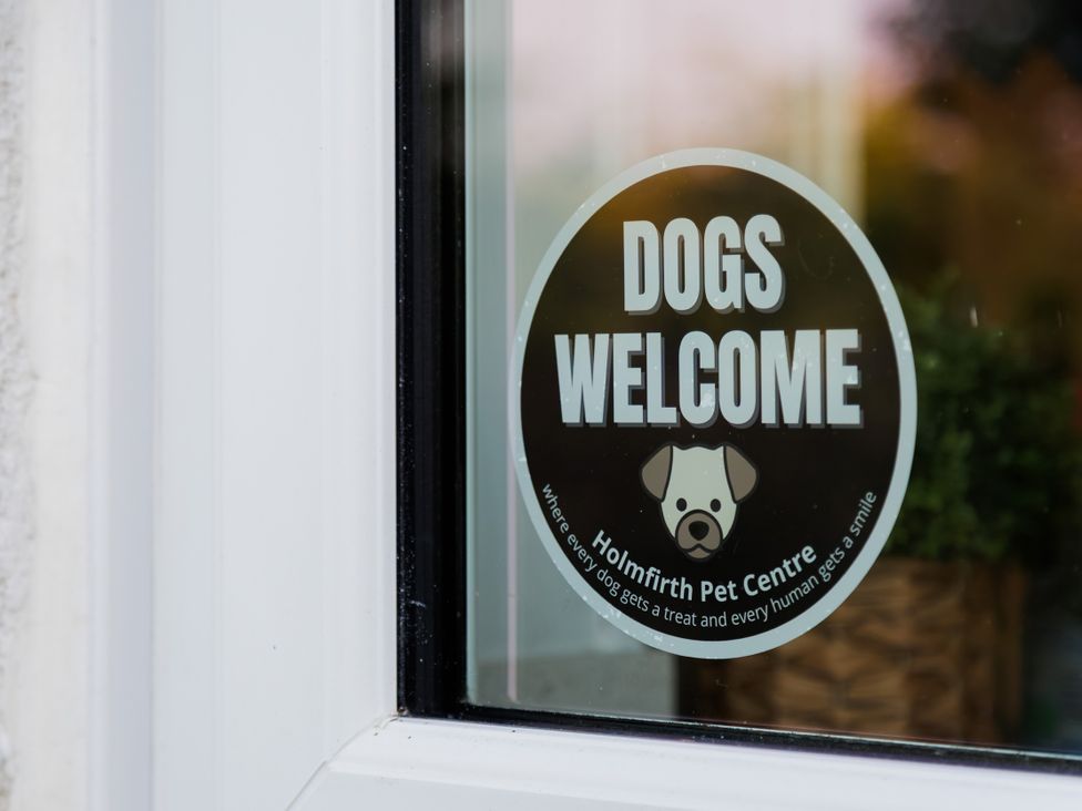 A dogs welcome sign at Holmfirth Pet Centre in Holmfirth