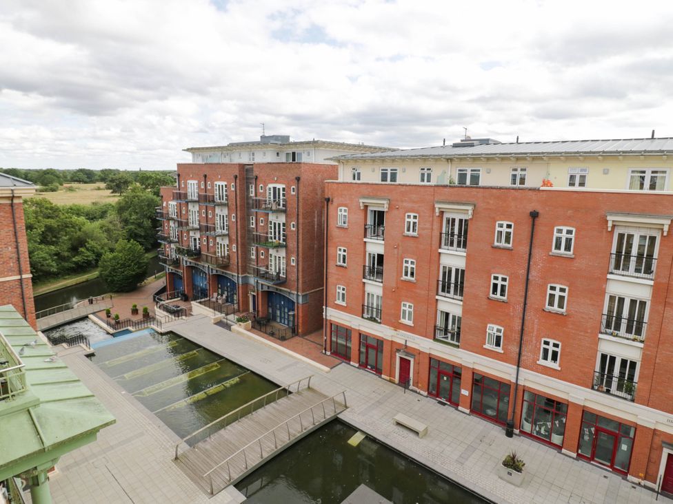 An apartment complex with a water feature and balconies at 63 Vista Heights in Solihull