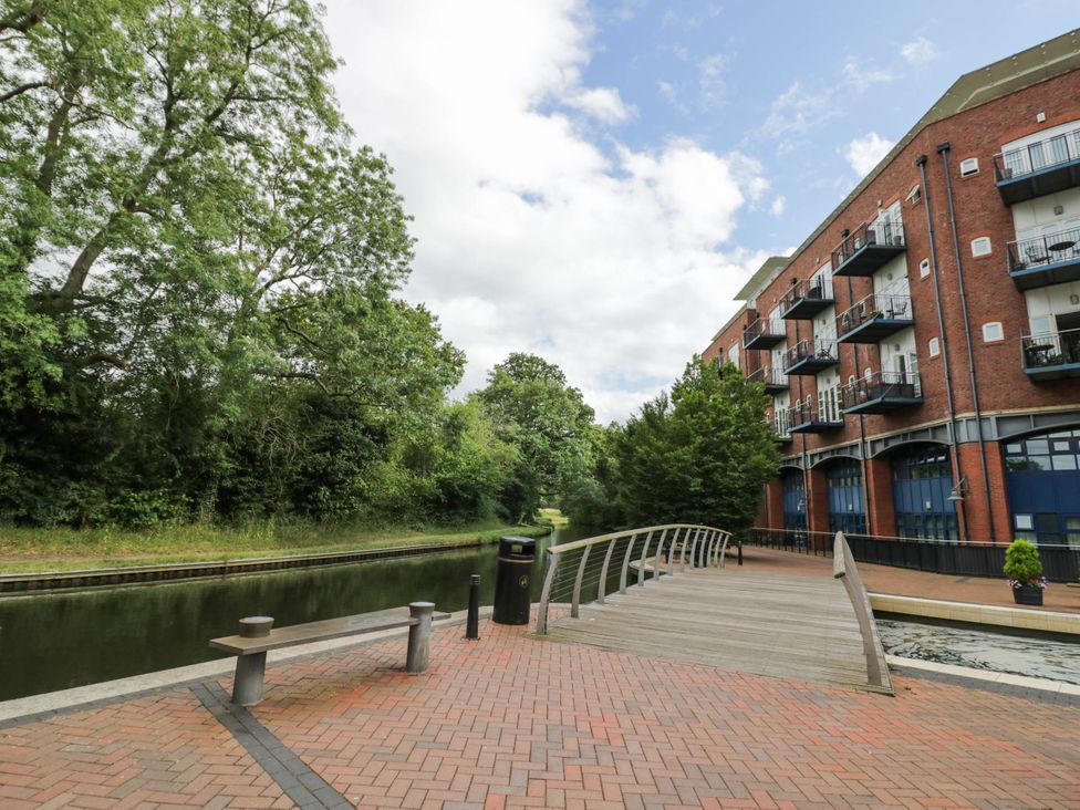 A canal view with a bridge and buildings at 63 Vista Heights Solihull