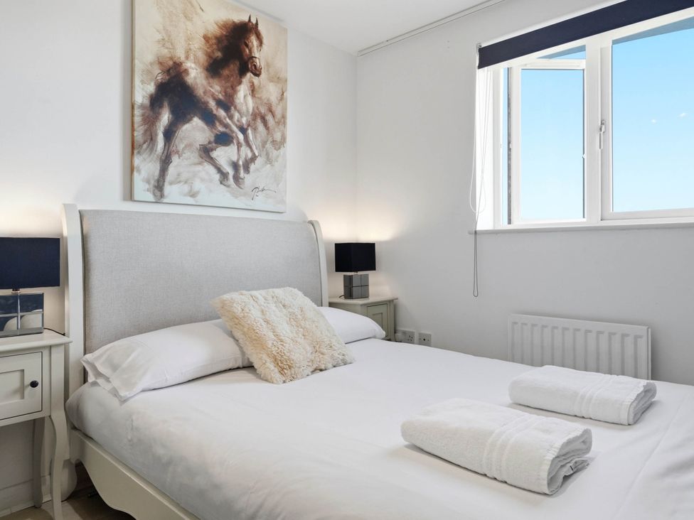 A bedroom with a bed and bedside tables at 63 Vista Heights Solihull