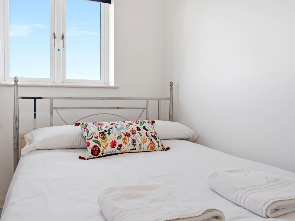 A bedroom with a bed and pillows at 63 Vista Heights Solihull