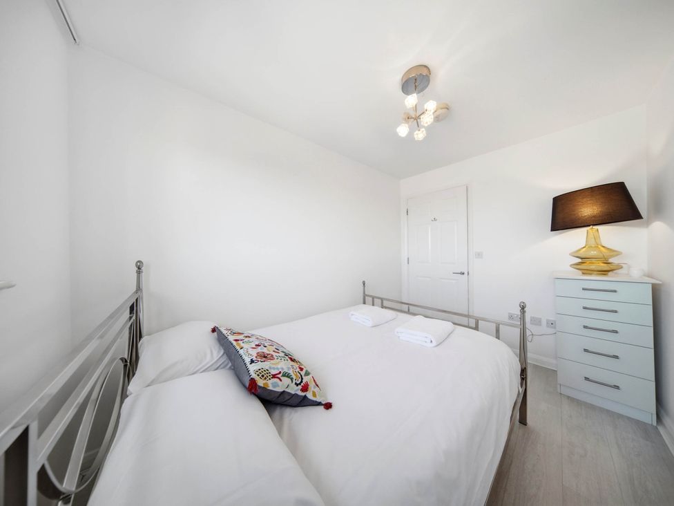 A bedroom with a bed and chest of drawers at 63 Vista Heights Solihull