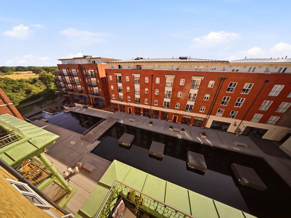 An outdoor view of buildings and water features at 63 Vista Heights Solihull