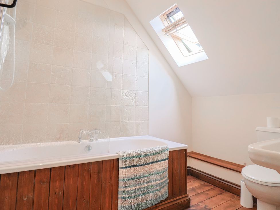 A bathroom with bathtub and toilet at 10 The Gardens Rousdon near Lyme Regis
