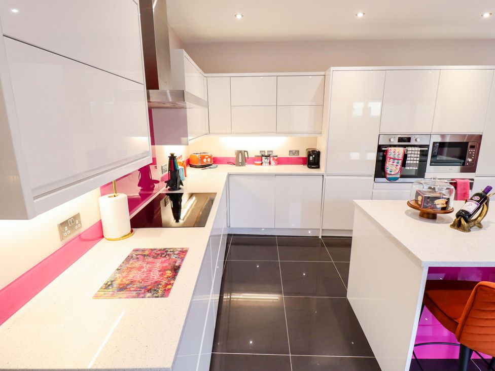 A kitchen with cabinets and countertop appliances at 105 Spilsby Road Boston
