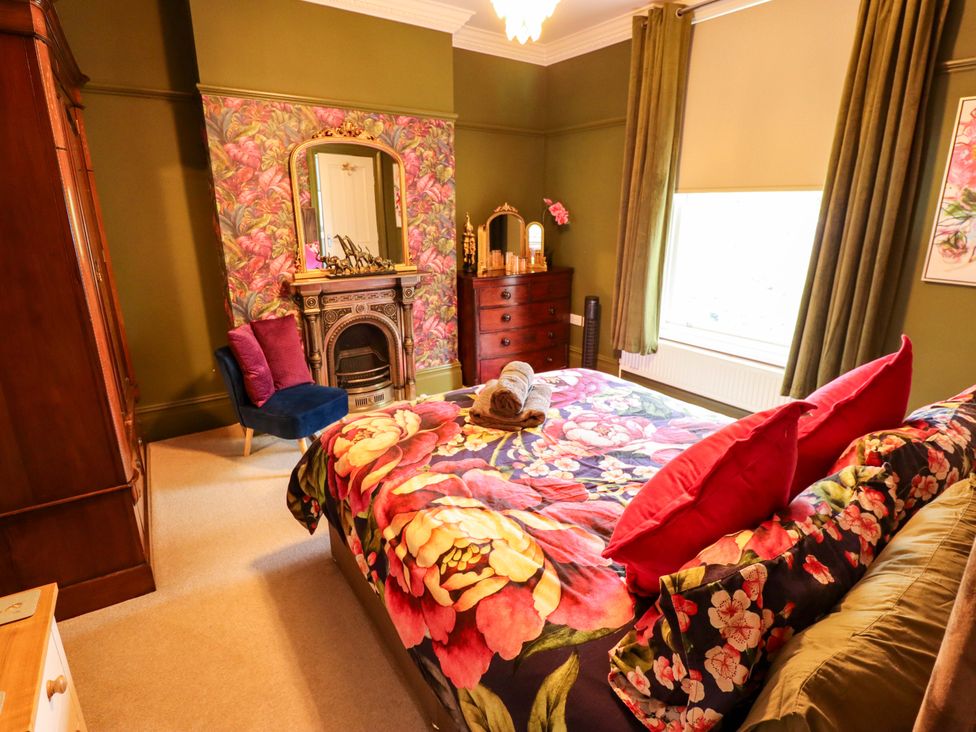 A bedroom with a bed and a dresser at 105 Spilsby Road Boston