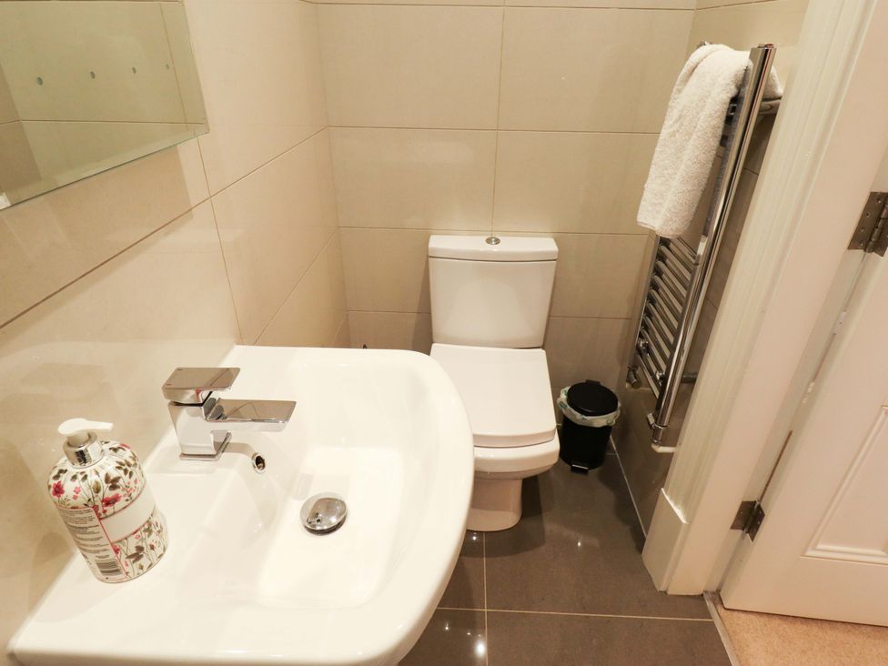 A bathroom with a sink and toilet at 105 Spilsby Road in Boston