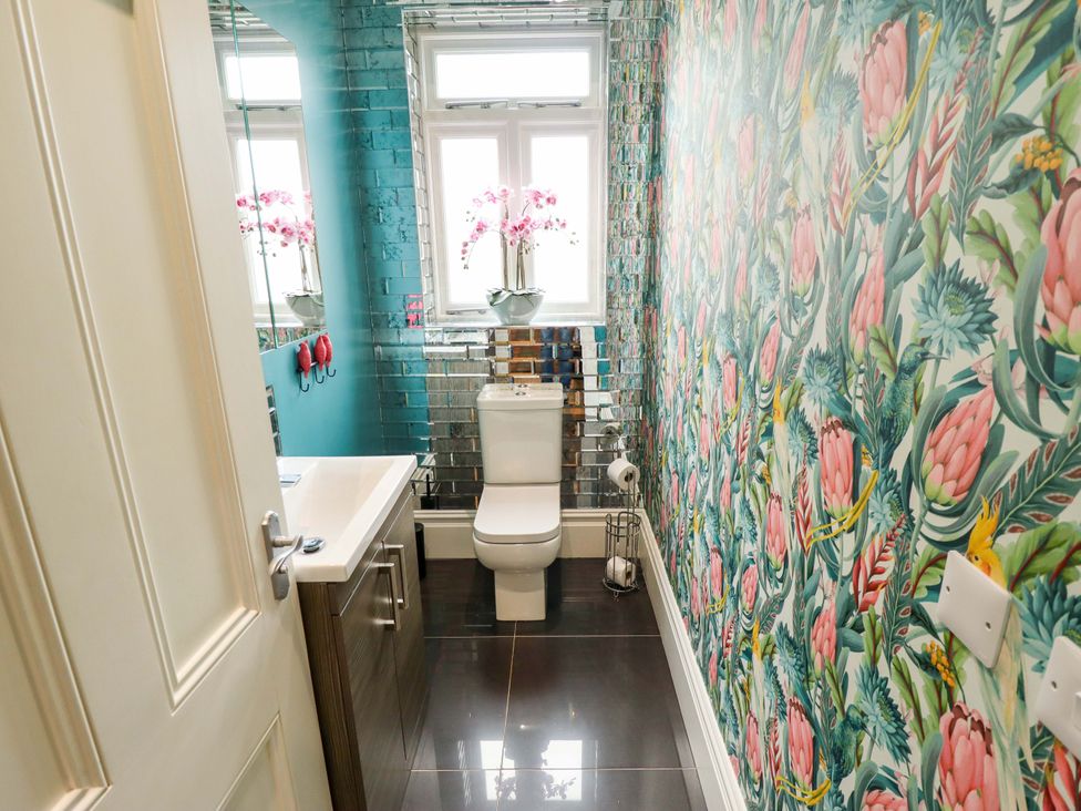 A bathroom with a toilet and sink at 105 Spilsby Road in Boston