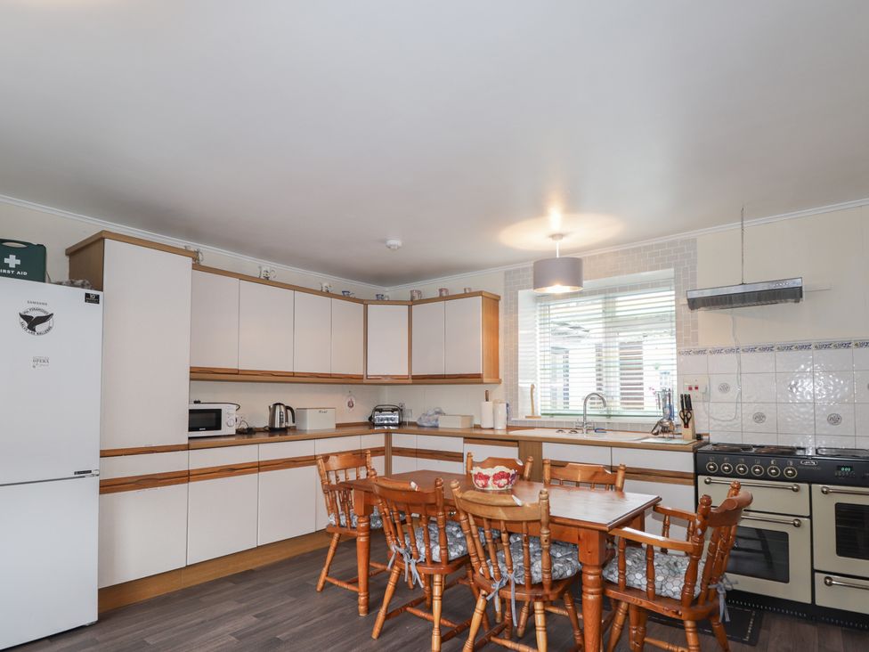 A kitchen with table and chairs at Ivy House in Kingussie