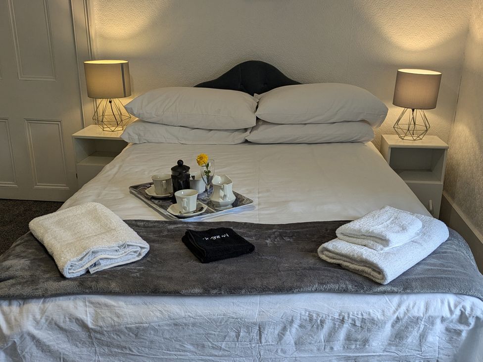 A bedroom with a bed and tray on it at Ivy House in Kingussie