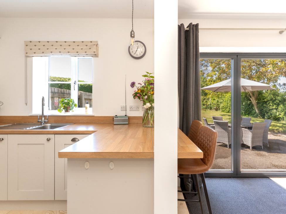A kitchen with sink and counter at Tokenhill Cottage Piddletrenthide