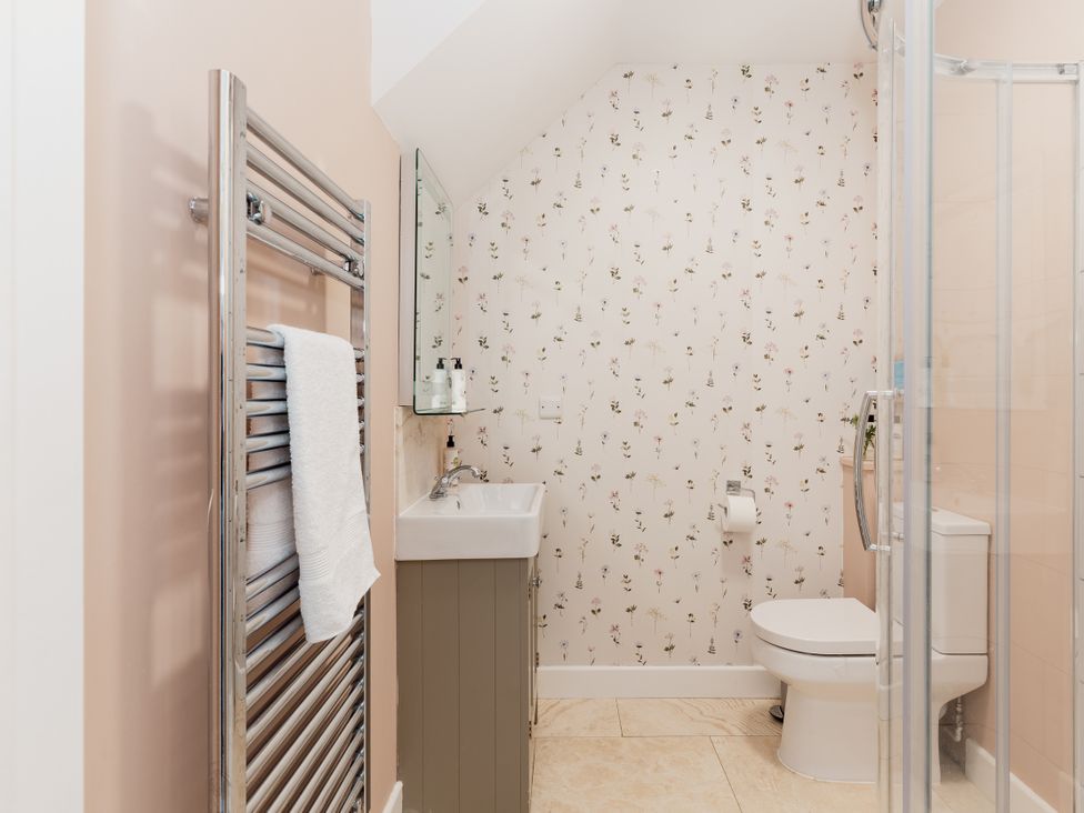 A bathroom with a sink and toilet at Tokenhill Cottage in Piddletrenthide
