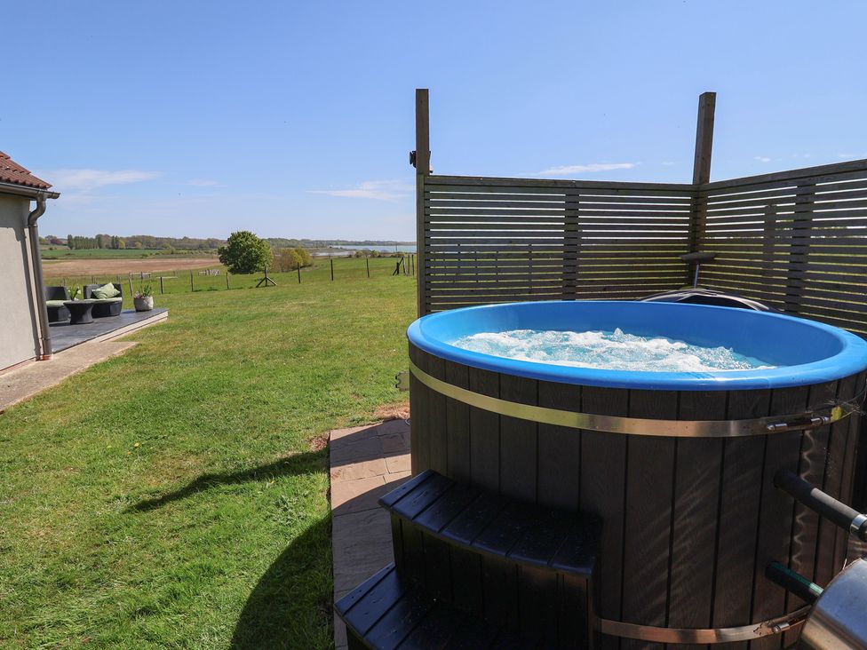 A hot tub in an outdoor area at Polly's Annexe in Levington