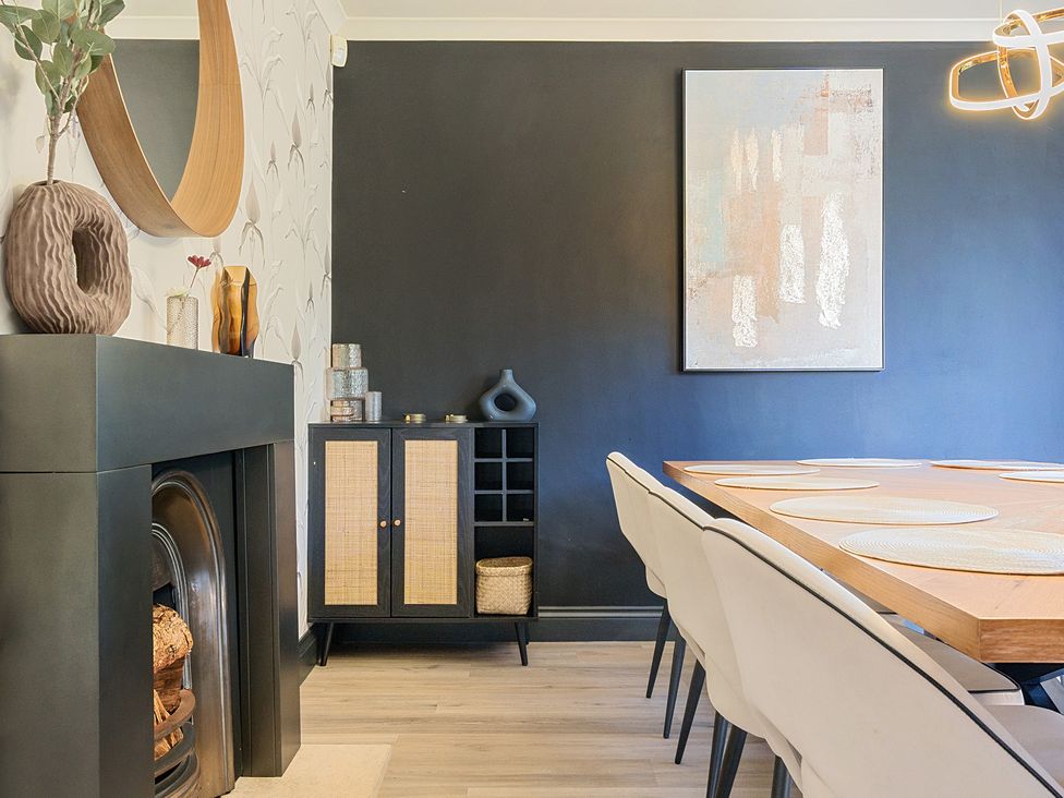 A dining room with a table and chairs at 8 Newmarket Road in Royston