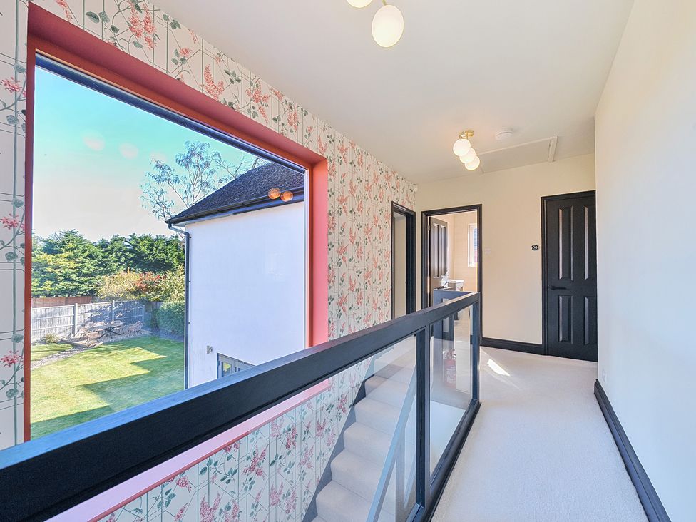 A hallway with windows and doors at 8 Newmarket Road Royston