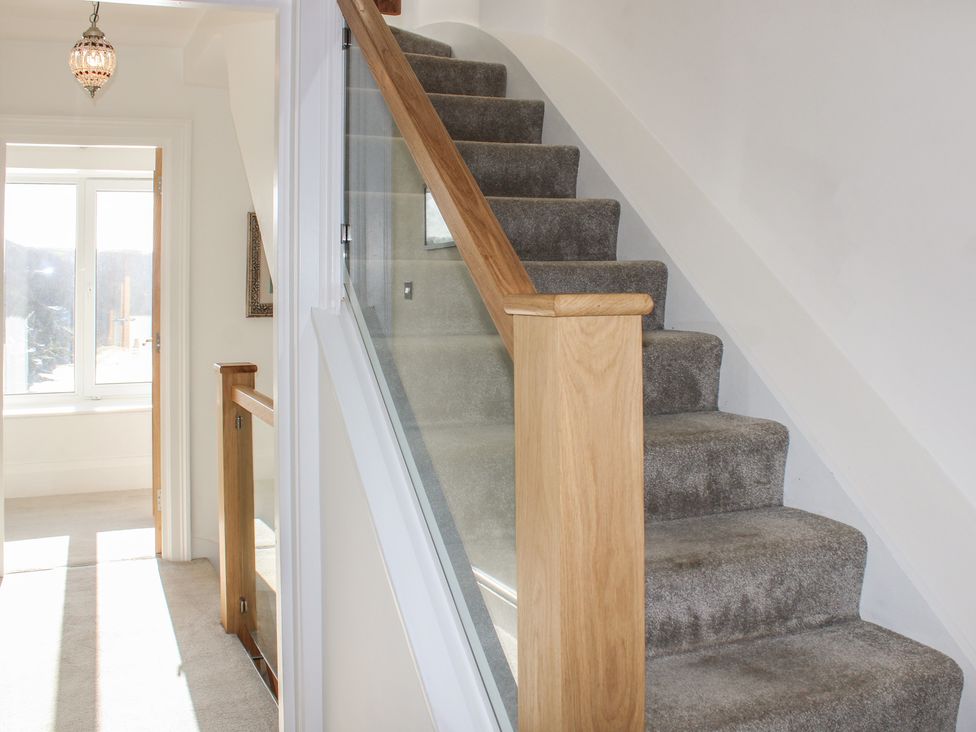 A staircase and hallway at 2 Channel View in Salcombe