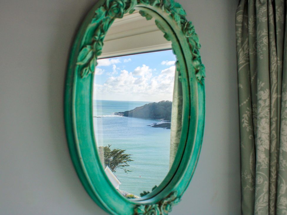 A mirror reflecting the ocean view at 2 Channel View in Salcombe