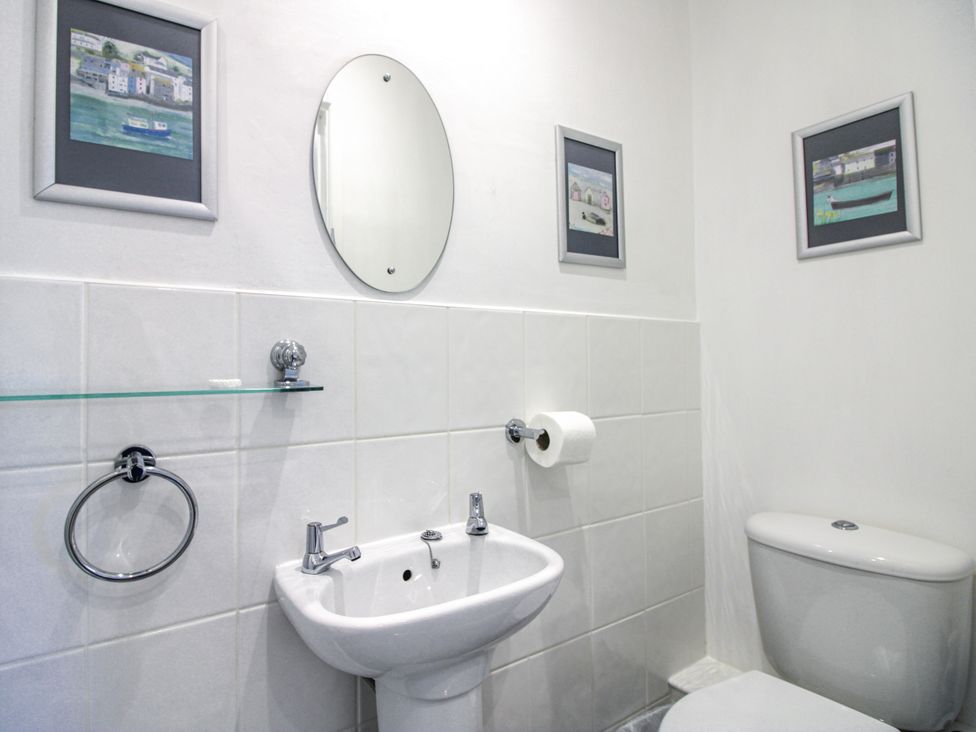 A bathroom with a sink and toilet at 2 Channel View in Salcombe