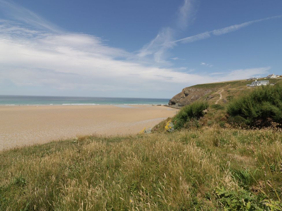 A beach view with sand and ocean at Little Trebah Atlantic Bays Holiday Park near St Merryn