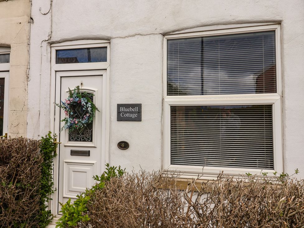 A door and window of Bluebell Cottage in Brayton