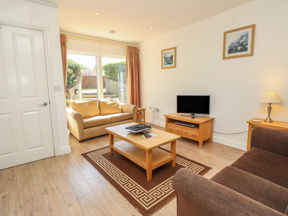 A living room with a sofa and coffee table at Delaware M2 Yarmouth