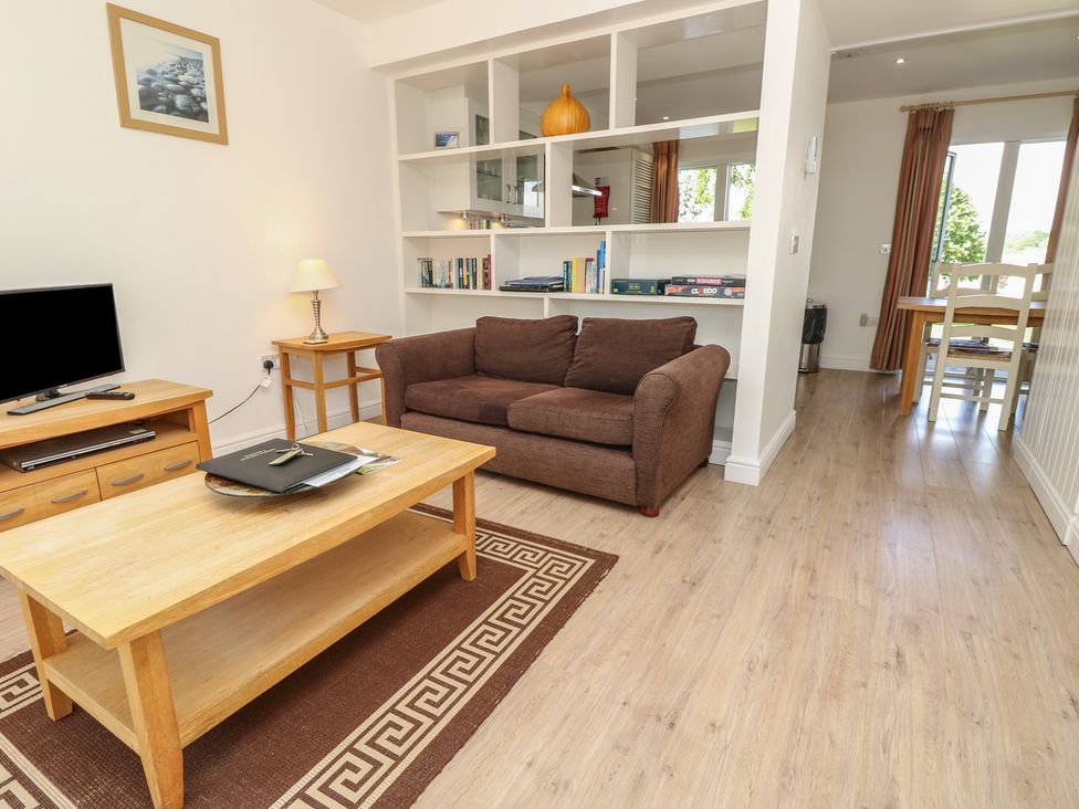 A living room with a sofa and coffee table at Delaware M2 in Yarmouth