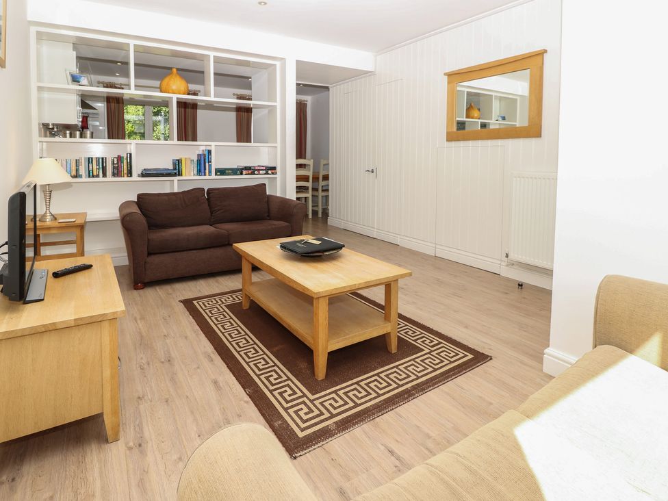 A living room with a sofa and coffee table at Delaware M2 in Yarmouth