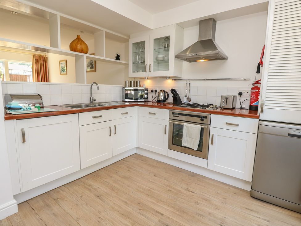 A kitchen with sink, oven, and cabinets at Delaware M2 in Yarmouth