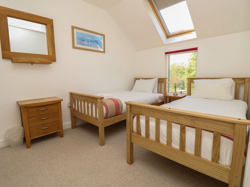 A bedroom with two single beds and a nightstand at Delaware M2 in Yarmouth
