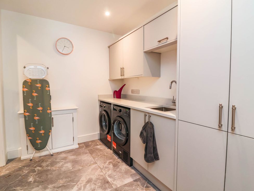 A laundry room with washing machine and dryer at The Granary in Barnstaple