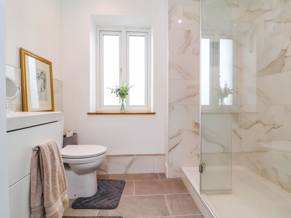 A bathroom with a shower and toilet at The Granary in Barnstaple