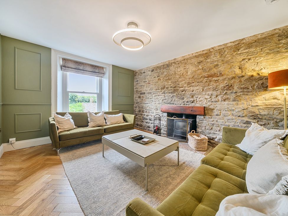 A living room with a sofa and a coffee table at Hillside House Aysgarth near West Witton