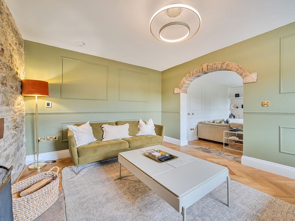 A living room with a sofa and a coffee table at Hillside House Aysgarth near West Witton