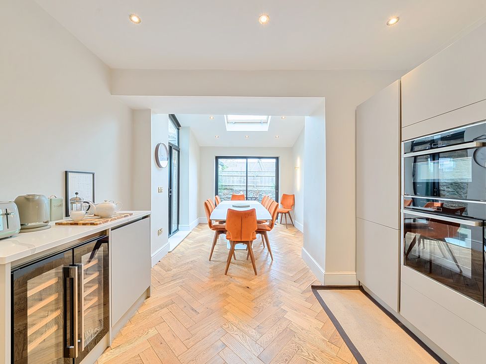 A kitchen with a dining table and chairs at Hillside House in Aysgarth near West Witton