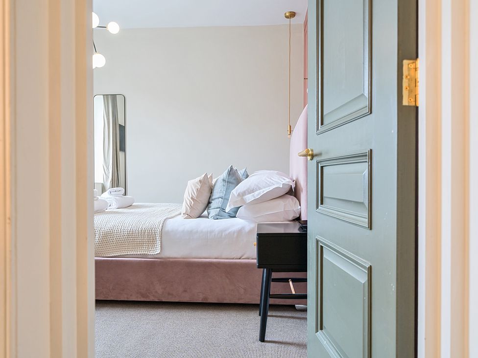 A bedroom with a bed and nightstand at Hillside House Aysgarth near West Witton