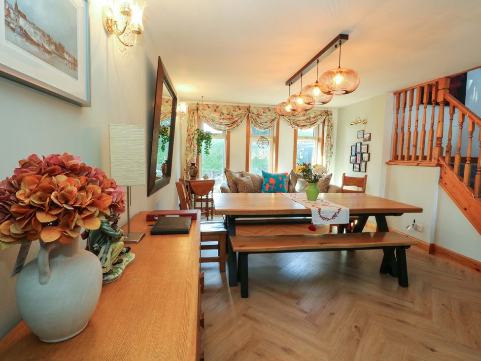 A dining room with a large table and chairs at Ninevah, Balquhidder, Perthshire, Scotland