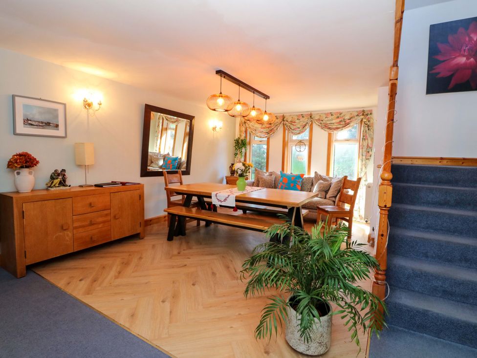 A dining room with a table and chairs at Ninevah in Balquhidder, Perthshire, Scotland