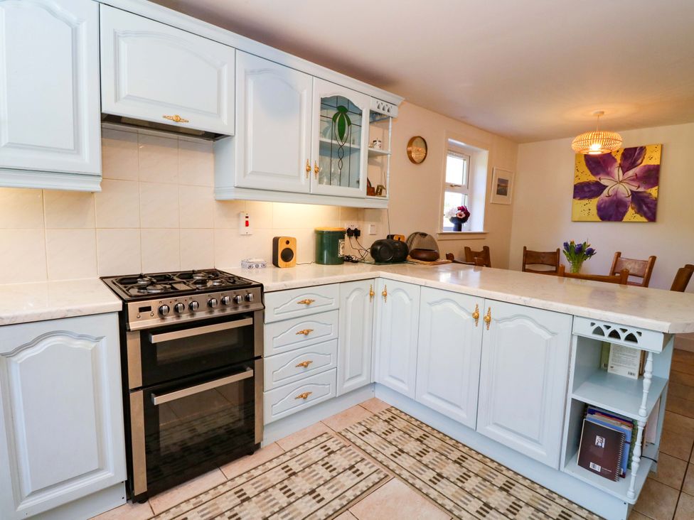 A kitchen with cabinets and appliances at Ninevah, Balquhidder, Perthshire, Scotland