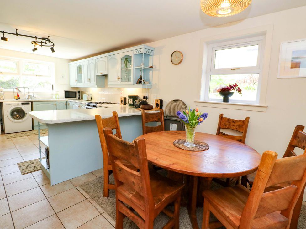 A kitchen with dining table and chairs at Ninevah, Balquhidder, Perthshire, Scotland