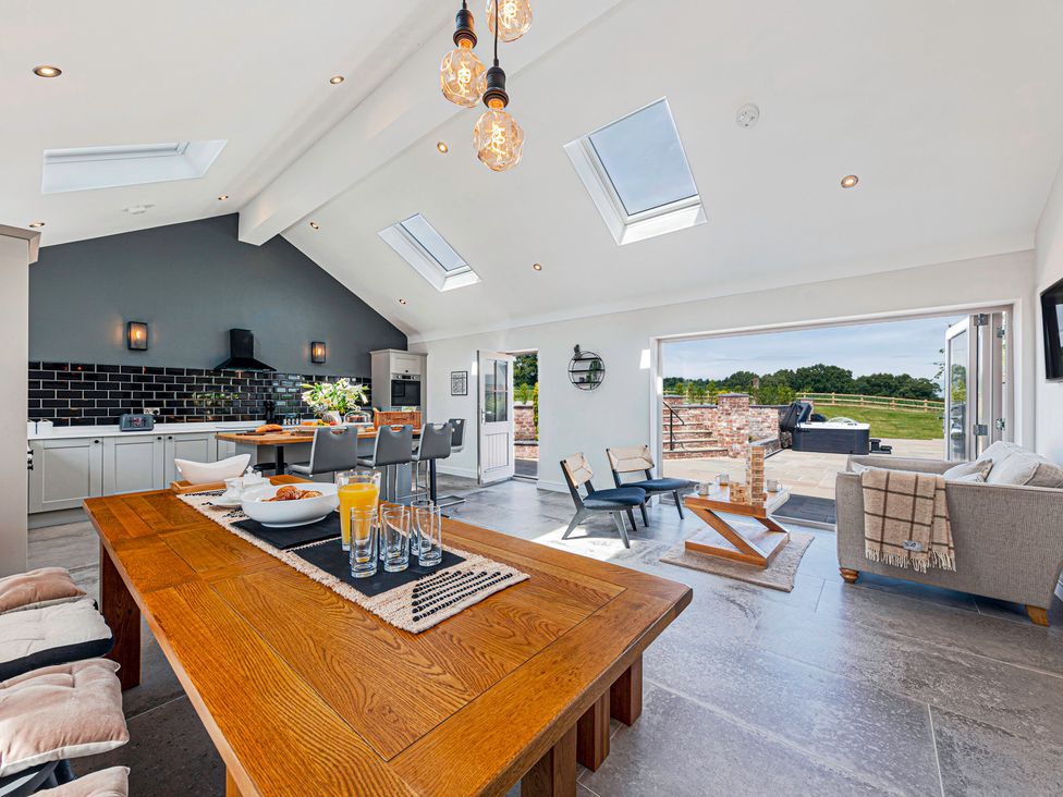 A kitchen and dining area with a large table at Fairvale House 