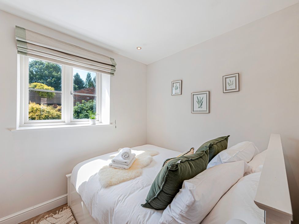 A bedroom with a bed and window at Fairvale House