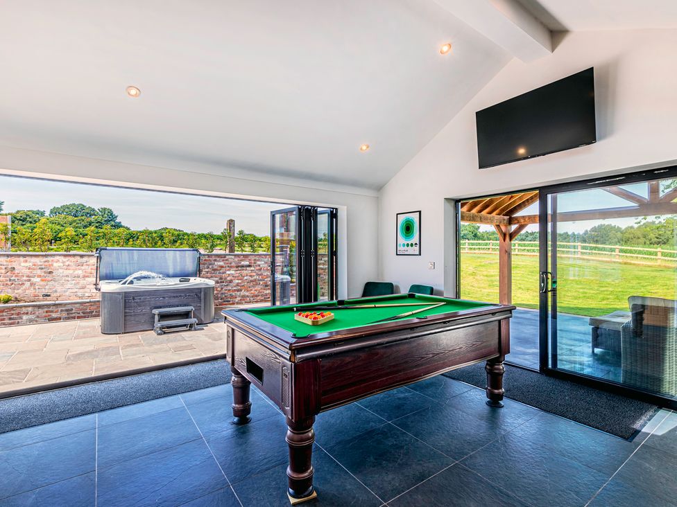 A game room with a pool table and hot tub at Fairvale House