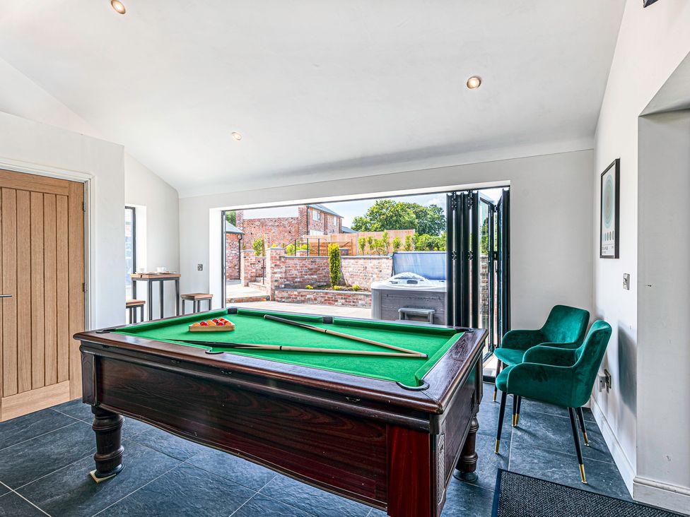 A game room with a pool table at Fairvale House