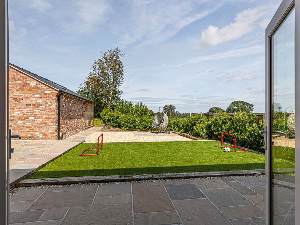 A garden with grass and soccer goal at Fairvale House
