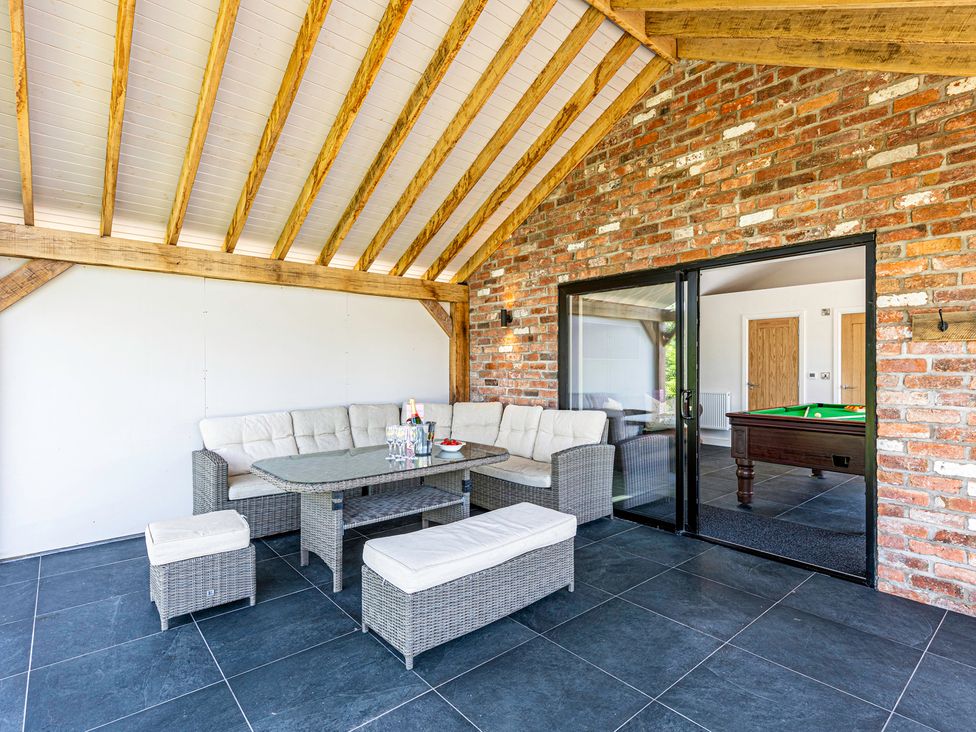 A seating area with a sofa and coffee table at Fairvale House