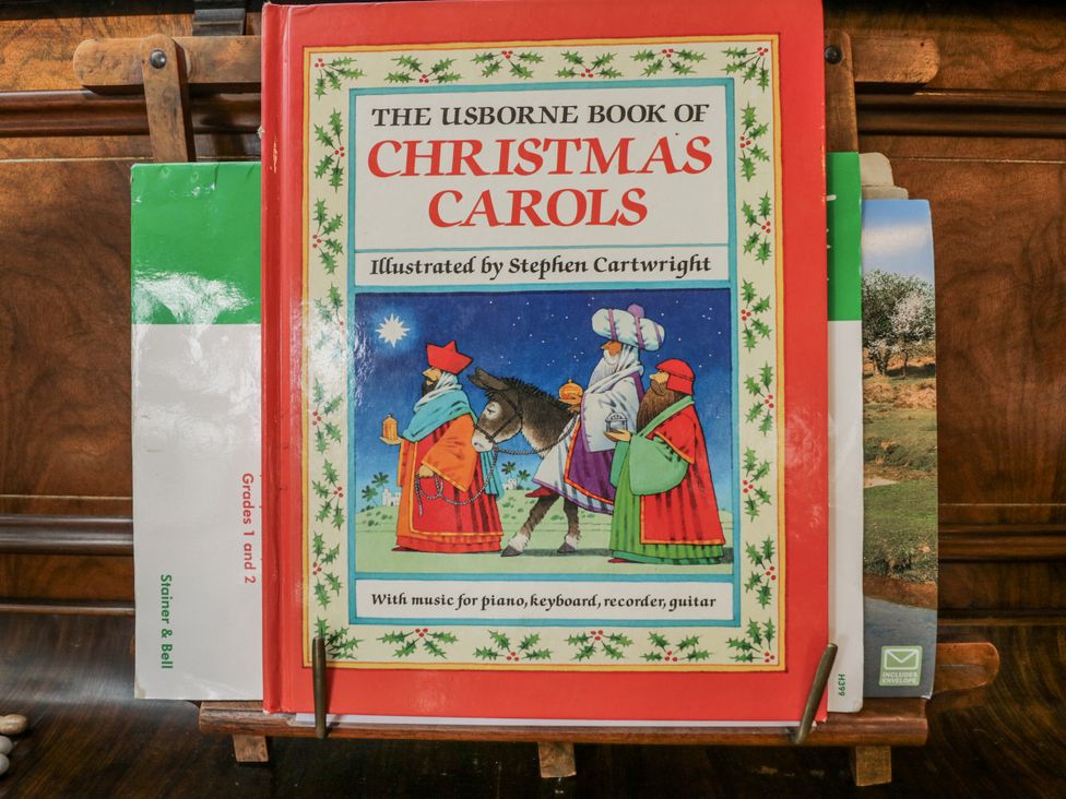 The Usborne Book of Christmas Carols on a book stand at The Old Byre in Woodfalls